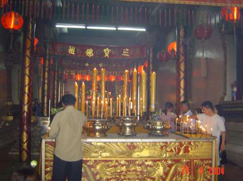 lighting candles inside the temple