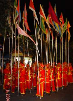 guys with flags on really long poles