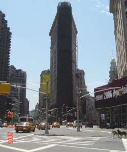 the Flat Iron Building with a temporary bib